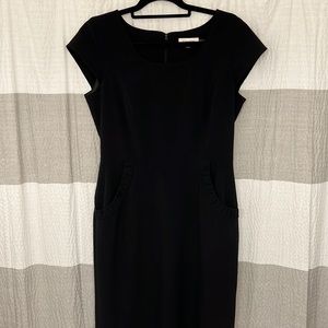 Calvin Klein women’s sheath dress with ruffled pockets. Black color, size 8.